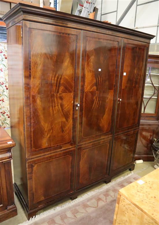 An Edwardian mahogany and boxwood line inlaid two door compactum wardrobe, W.194cm, D.61cm, H.215cm